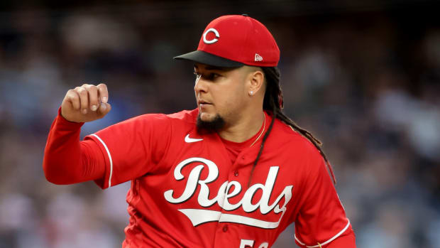 Cincinnati Reds starting pitcher Luis Castillo (58) follows through on a pitch against the New York Yankees.